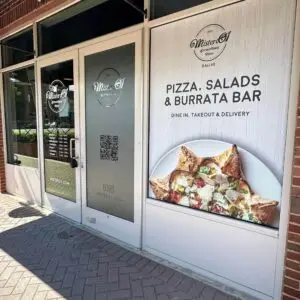 The front door decal signs for Mister 01 Pizza